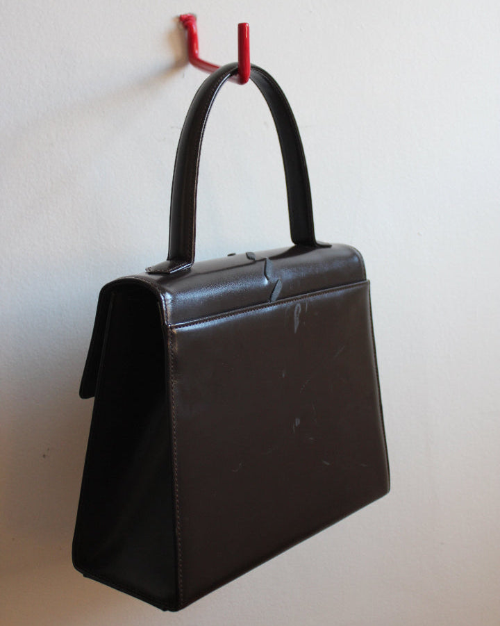 back view of vintage chocolate brown top handle YSL bag from the 70s