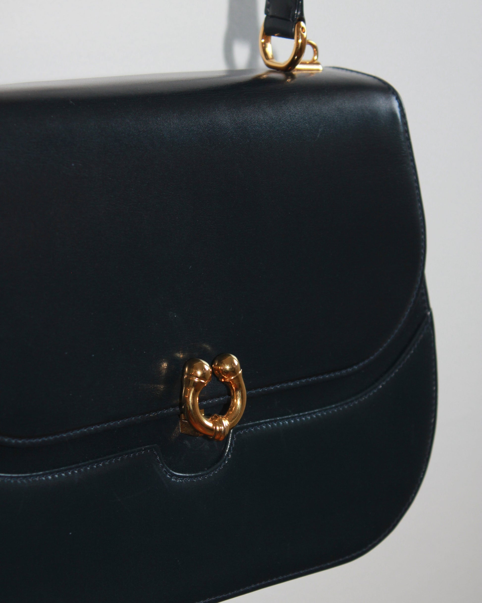 gold detailing on vintage navy blue calfskin gucci handbag