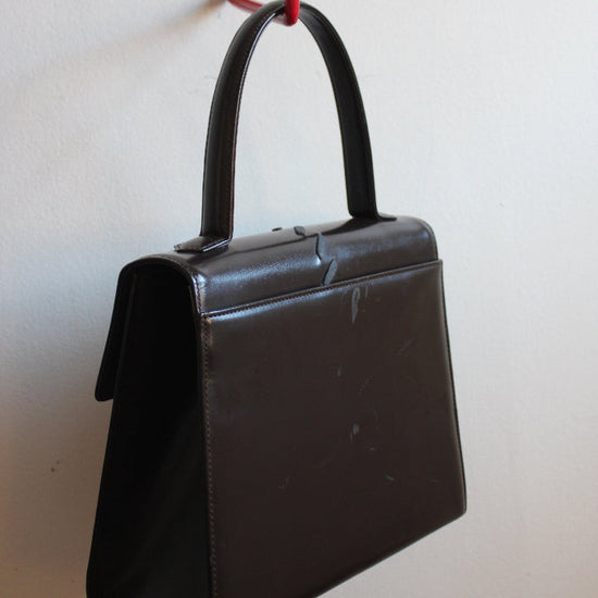back view of vintage chocolate brown top handle YSL bag from the 70s