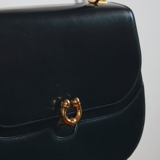 gold detailing on vintage navy blue calfskin gucci handbag