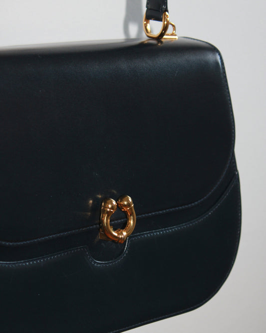 gold detailing on vintage navy blue calfskin gucci handbag