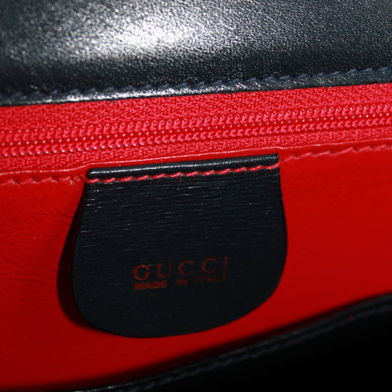 interior gucci label on vintage navy calfskin handbag with red leather interior